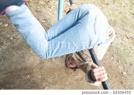 Girl playing the horizontal bar 88308459
