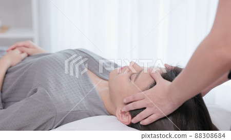 They're having the time of their lives, relaxing and rejuvenating. Giving yourself a face massage 88308684