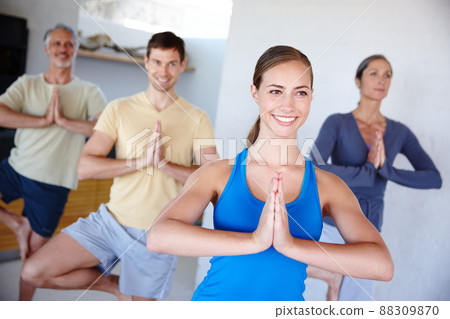 The whole familys joining in today. A cropped shot of a happy family doing yoga together. 88309870