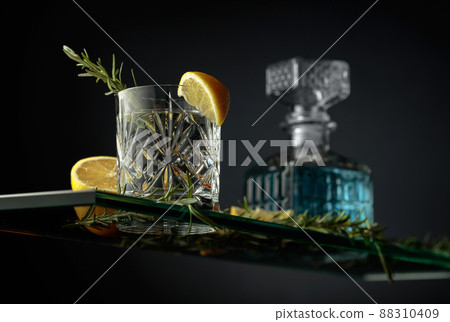 Gin tonic cocktail in a crystal glass. 88310409