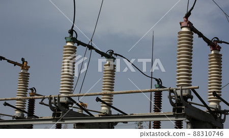 Power station. Transmission towers to provide energy to a residential area. Steel structures for generating electricity Power station. Transmission towers to provide energy to a residential area. Steel structures for generating electricity 88310746