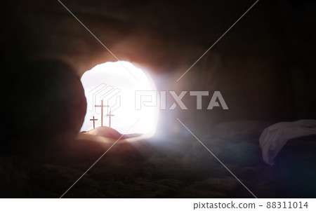 Empty tomb and cross symbolizing the resurrection of Jesus Christ and Easter Empty tomb and cross symbolizing the resurrection of Jesus Christ and Easter 88311014