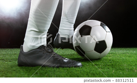 Soccer player in action, ready to kick the ball Soccer player in action, ready to kick the ball 88312511