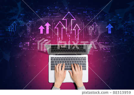 Rising arrow theme with person using laptop 88313959