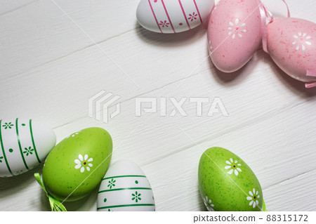 Colorful Easter eggs on white wooden background 88315172