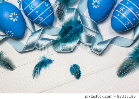 Blue Easter eggs on white wooden background 88315186