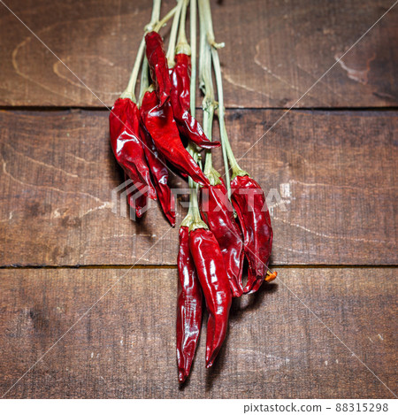 Red hot chili peppers on a wooden background 88315298