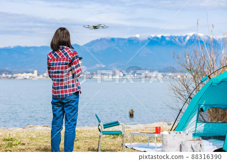 Woman steering drone 88316390