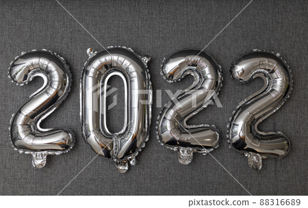 new year 2022 shiny silver balloons on grey background new year 2022 shiny silver balloons on grey background 88316689