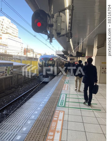 This is a limited express review that comes into the station on the Seibu line. 88316704