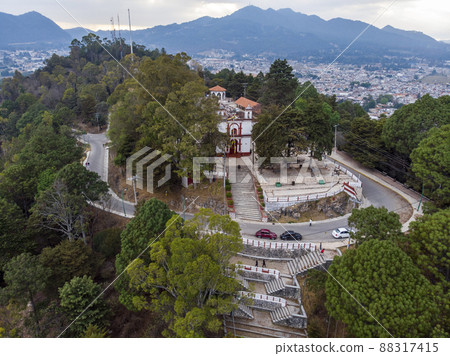 Aerial Drone shot of Church Iglesia de San Cristobalito on the mountain in San Cristobal de Las Casas, Chiapas, Mexico Aerial Drone shot of Church Iglesia de San Cristobalito on the mountain in San Cristobal de Las Casas, Chiapas, Mexico 88317415