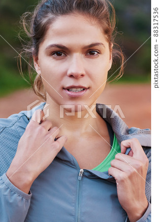 Im focused and ready for the burn. Shot of a young woman out for a trail run. 88317536