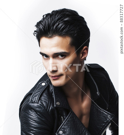 young handsome man, leather jacked on naked torso, emotional posing, white background, modern guy, lifestyle people concept 88317727