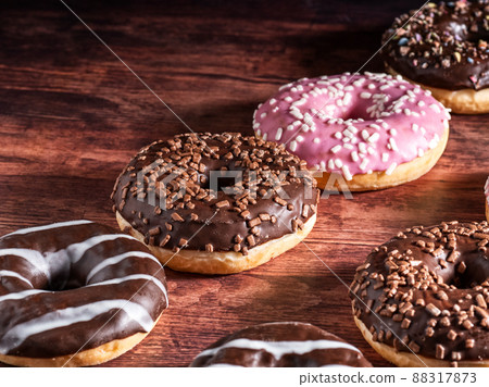 The doughnuts are freshly baked on a beautiful background. The doughnuts are freshly baked on a beautiful background. 88317873