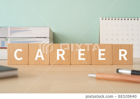 A desk with building blocks labeled "CAREER" 88320640