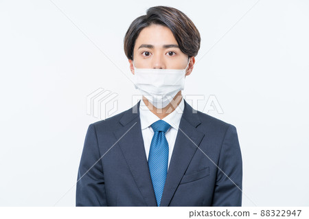 A man in a suit with a nose mask 88322947