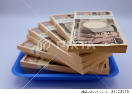 A bundle of bills on the tray A bundle of bills on the tray 88323976