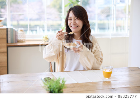 A woman to have breakfast A woman to have breakfast 88325777