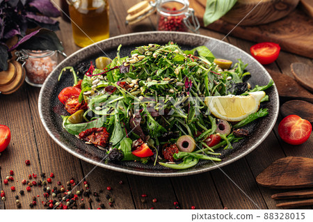 Green mediterranean salad with pine nuts Green mediterranean salad with pine nuts 88328015