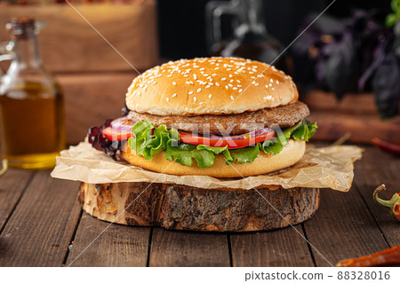 Fresh appetizing burger on wooden background Fresh appetizing burger on wooden background 88328016