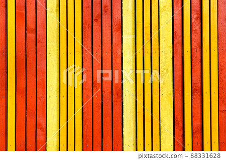 a wall of vertical narrow wooden planks painted in different bright colors a wall of vertical narrow wooden planks painted in different bright colors 88331628