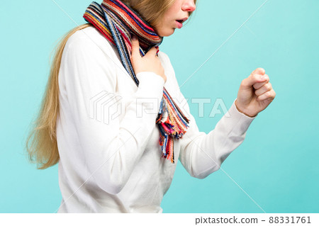 Cold And Flu. Portrait Of Beautiful Teen Girl With Cough And Sore Throat Feeling Sick Indoors. Cold And Flu. Portrait Of Beautiful Teen Girl With Cough And Sore Throat Feeling Sick Indoors. 88331761