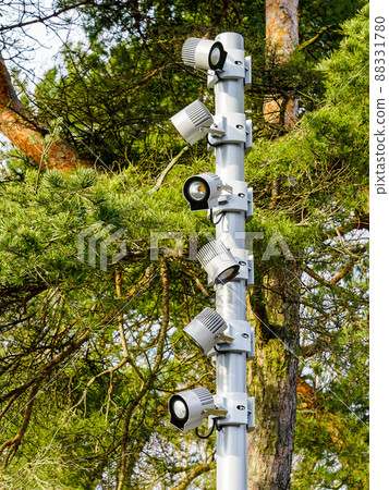 new modern lighting pole with several led lights in the city park new modern lighting pole with several led lights in the city park 88331780