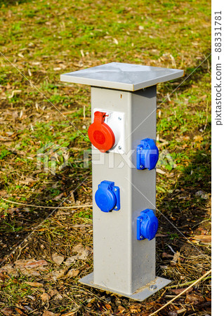 new modern multiple electrical outlets on a low metal pole in a city park new modern multiple electrical outlets on a low metal pole in a city park 88331781