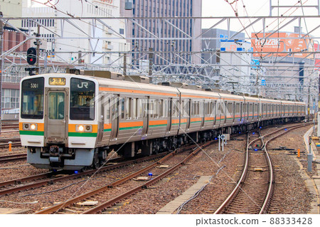 Chuo Line 211 series commuter train arriving at Nagoya Station 88333428