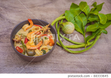 Thai food chicken green curry on dark wooden background. top view Thai food chicken green curry on dark wooden background. top view 88333645
