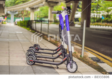 Electric scooters for rent. urban transport. Electric Ride Sharing Scooters Lined Up and Ready to Rent 88333806