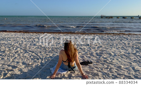 Sitting at a beach on Key West 88334034