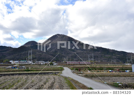 Mt. Nijo and Kintetsu train in winter 88334320