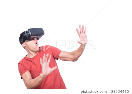 Amazed man in exploring virtual reality in VR glasses 88334480