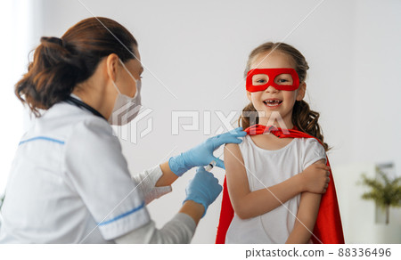 Doctor vaccinating child 88336496