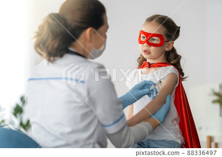 Doctor vaccinating child Doctor vaccinating child 88336497