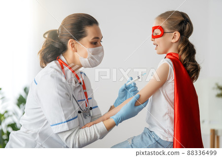 Doctor vaccinating child Doctor vaccinating child 88336499