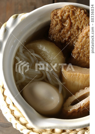 A bird's-eye view of a one-person oden containing boiled eggs, radishes, chikuwa, Jakoten, Shirataki, and kamaboko. 88336834