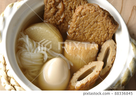 A bird's-eye view of a one-person oden containing boiled eggs, radishes, chikuwa, Jakoten, Shirataki, and kamaboko. 88336845