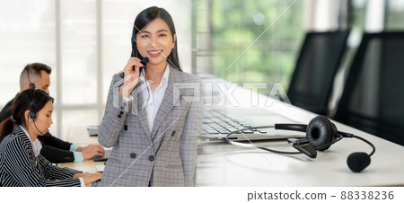 Business people wearing headset working in office broaden view Business people wearing headset working in office broaden view 88338236
