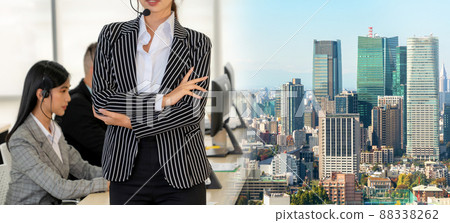 Business people wearing headset working in office broaden view Business people wearing headset working in office broaden view 88338262