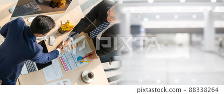 Group business people handshake at meeting table in widen view Group business people handshake at meeting table in widen view 88338264