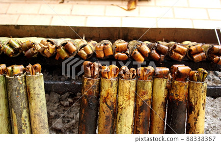 Row of sticky rice in bamboo roasted. 88338367
