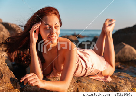 The beautiful woman in underwear on a beach Stock Photo by