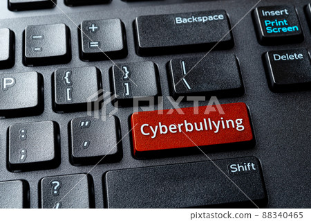 Cyberbullying word on a computer keyboard button. Laptop enter key with message cyberbullying. Cyberbullying word on a computer keyboard button. Laptop enter key with message cyberbullying. 88340465