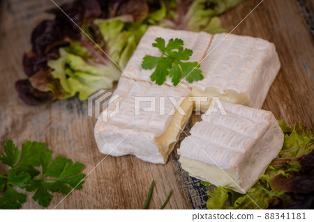 Pont l'Eveque, French Cheese from Normandy produced from Cow's Milk on turntable Pont l'Eveque, French Cheese from Normandy produced from Cow's Milk on turntable 88341181