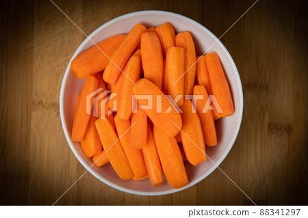 Preparing fresh carrots on wood table Preparing fresh carrots on wood table 88341297