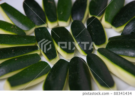 Preparing fresh courgette, zucchini on wood table Preparing fresh courgette, zucchini on wood table 88341434
