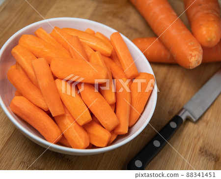 Preparing fresh carrots on wood table Preparing fresh carrots on wood table 88341451