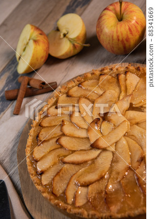 Delicious apple pie on a wooden table, from above Delicious apple pie on a wooden table, from above 88341669